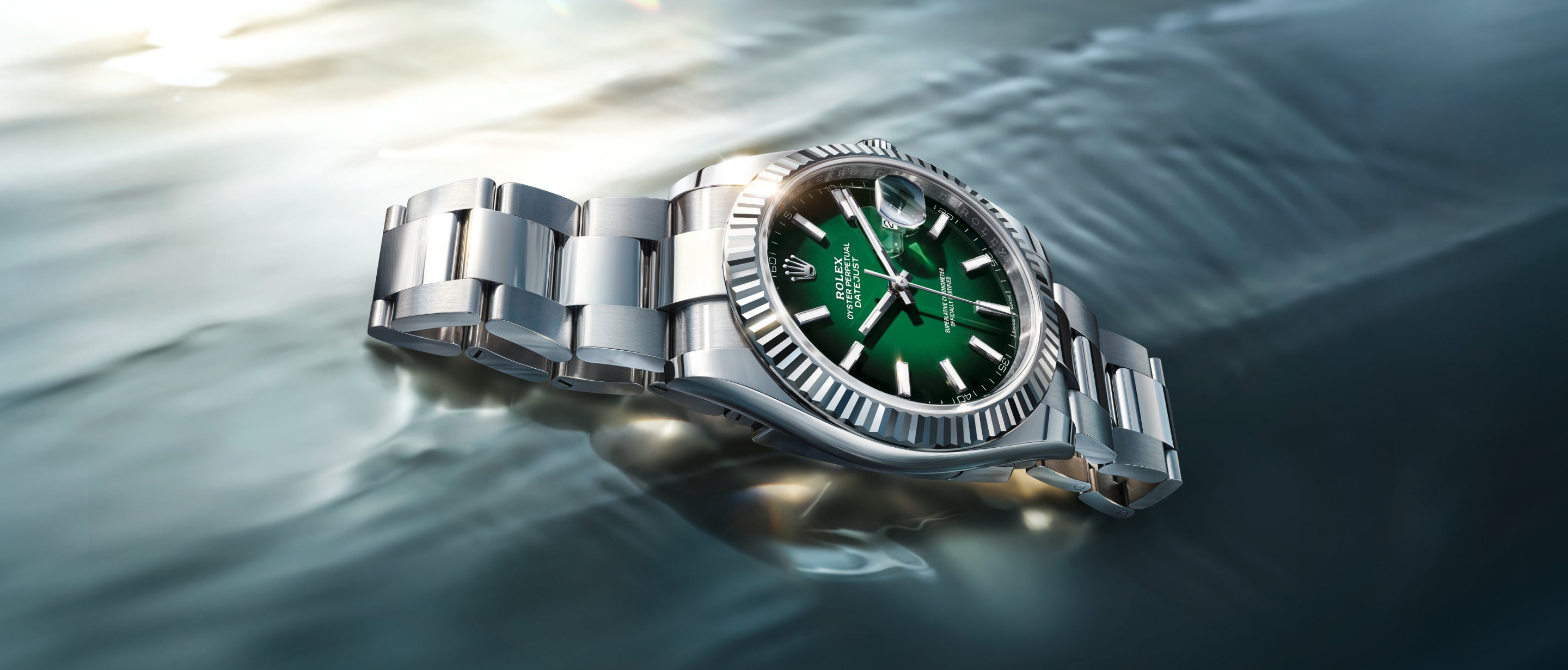 Rolex Datejust 41 white Rolesor with white gold fluted bezel and green lacquer ombré dial on water surface